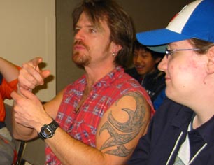 Scott McNeil sits with the people